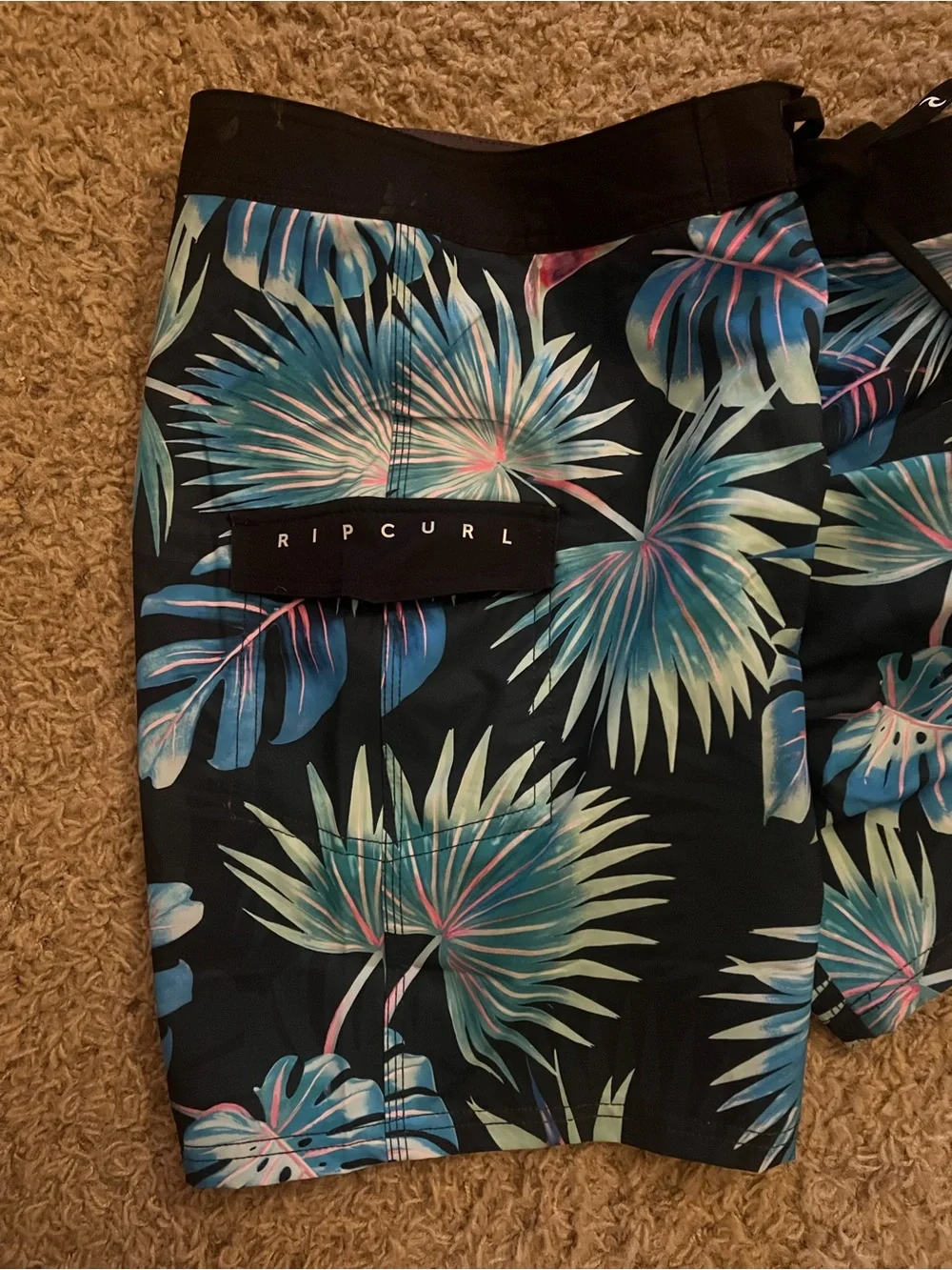 Rip Curl Black Swim Shorts with Blue-Green Tropical Leaves